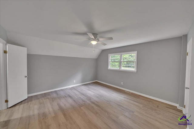 bonus room with ceiling fan, lofted ceiling, and light hardwood / wood-style flooring