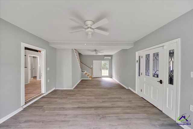 foyer with light wood-type flooring and ceiling fan