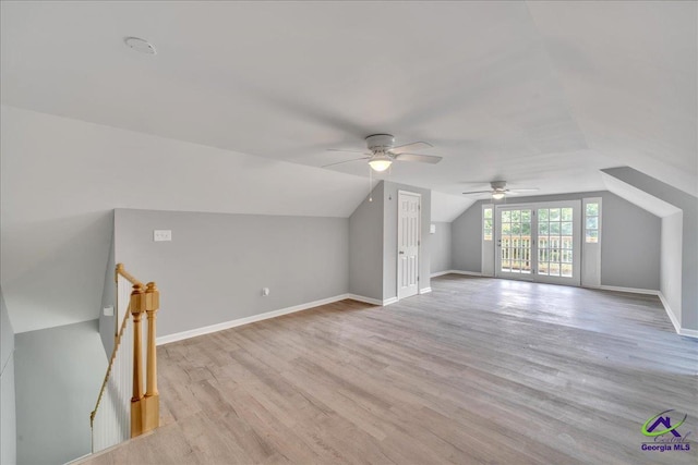 bonus room with light hardwood / wood-style floors, vaulted ceiling, and ceiling fan