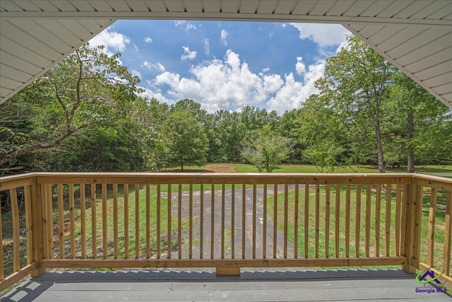 deck featuring a yard