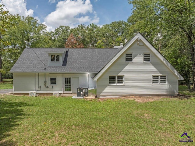 back of house featuring a yard and a patio