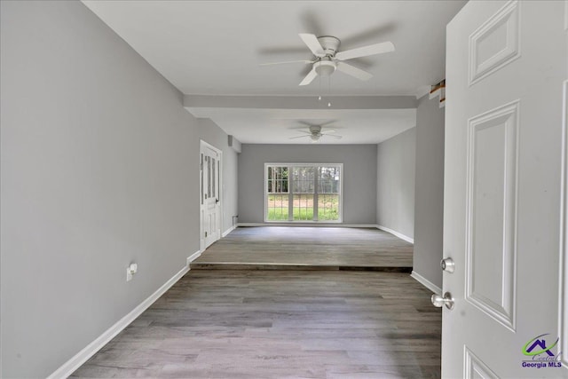 unfurnished room featuring light hardwood / wood-style floors and ceiling fan