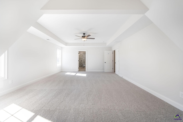 bonus room featuring ceiling fan and light carpet