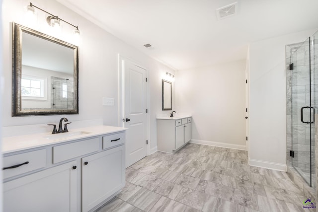 bathroom with an enclosed shower and vanity