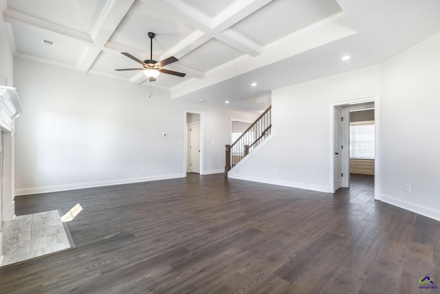 unfurnished living room with dark hardwood / wood-style floors, coffered ceiling, and beamed ceiling