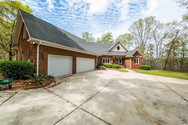 view of front of home featuring a garage and a front lawn