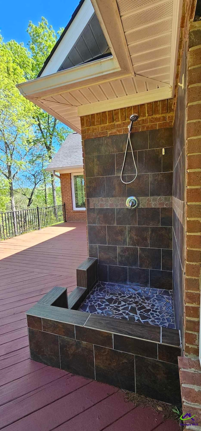 wooden terrace with an outdoor fire pit