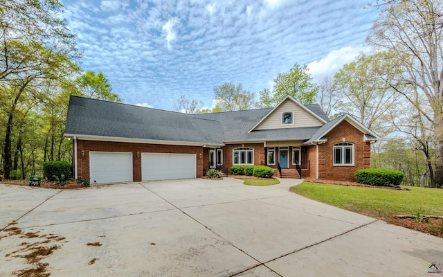 view of front facade with a garage and a front lawn