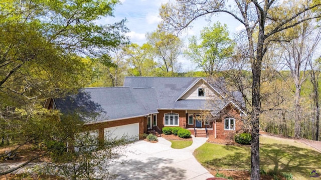 view of front of house with a garage and a front yard