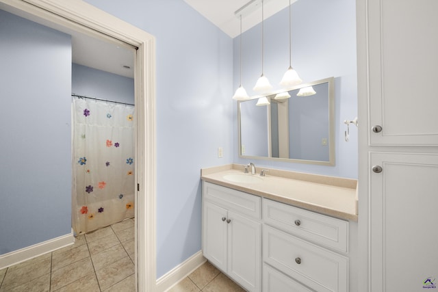 bathroom with vanity, a shower with shower curtain, and tile patterned flooring