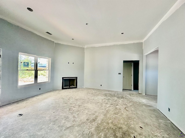 unfurnished living room with ornamental molding