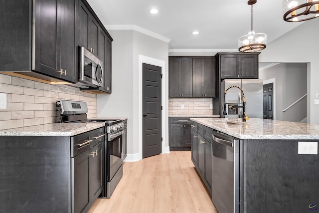 285 Lakeview Dr, Macon, GA 31211 - kitchen featuring stainless steel appliances, light wood-style flooring, ornamental molding, a sink, and backsplash