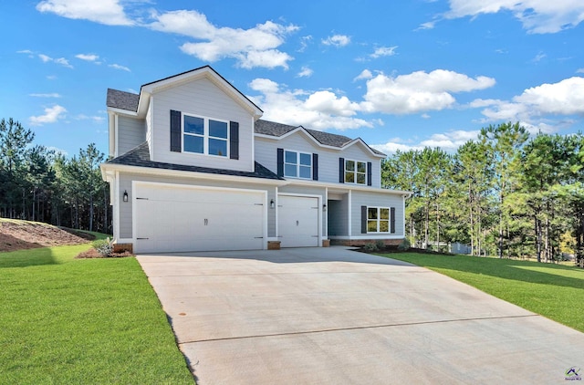 285 Lakeview Dr, Macon, GA 31211 - traditional-style house featuring an attached garage, driveway, a front lawn, and roof with shingles