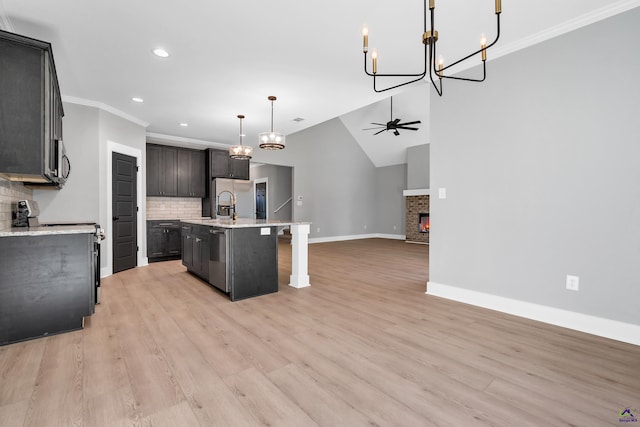 285 Lakeview Dr, Macon, GA 31211 - kitchen with a chandelier, baseboards, open floor plan, backsplash, and stainless steel appliances