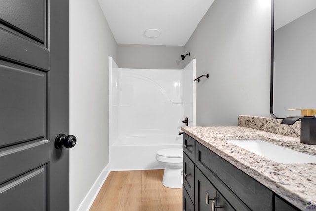 285 Lakeview Dr, Macon, GA 31211 - bathroom with vanity, toilet, wood finished floors,  shower combination, and baseboards
