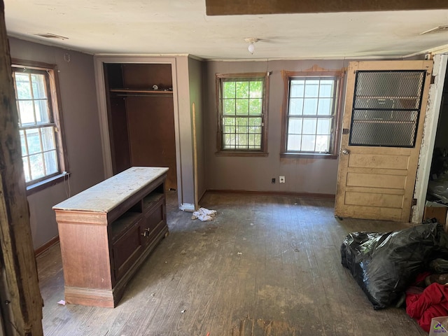 bedroom featuring a closet and dark hardwood / wood-style flooring