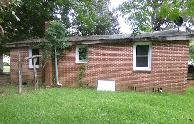 view of home's exterior featuring a lawn