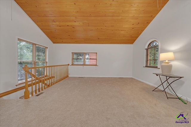 interior space with a wealth of natural light, high vaulted ceiling, and wood ceiling