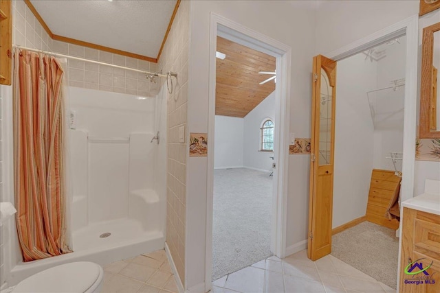 bathroom with tile patterned floors, wood ceiling, toilet, a shower with curtain, and vanity