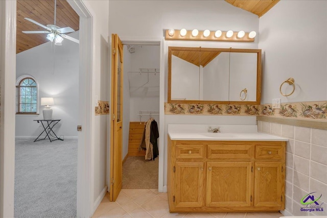 bathroom with lofted ceiling, ceiling fan, wooden ceiling, and vanity