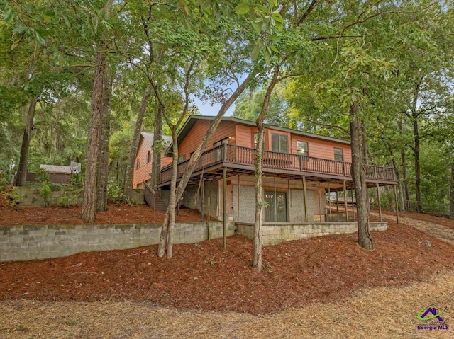 exterior space featuring a wooden deck