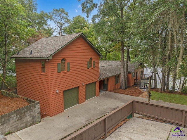 view of property exterior with a garage