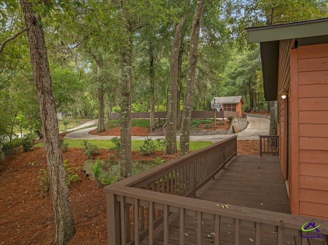 wooden deck featuring an outbuilding