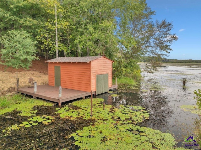 view of outbuilding featuring a water view