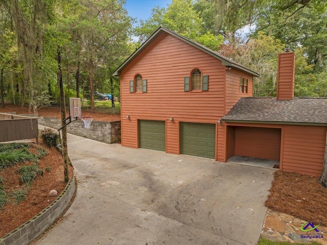 view of side of property with a garage