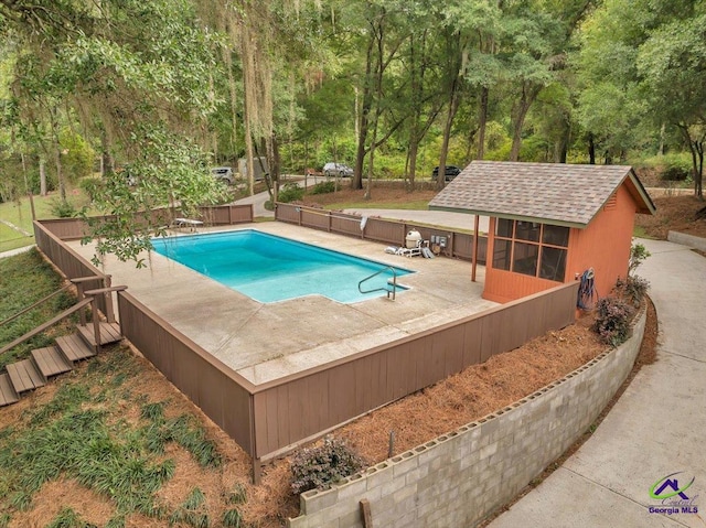 view of swimming pool featuring a patio area