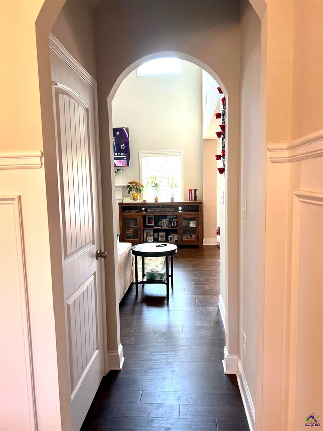 corridor with dark wood-type flooring