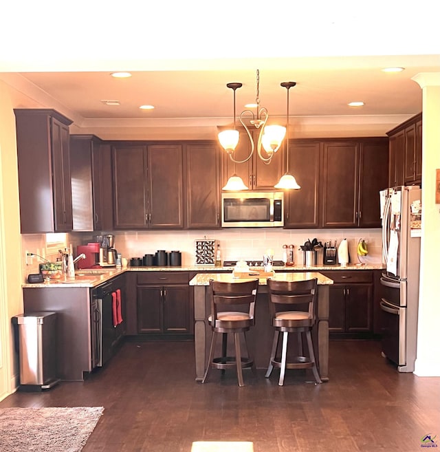 216 Brentfield Drs, Bonaire, GA 31005 - kitchen featuring backsplash, a kitchen island, stainless steel appliances, dark brown cabinets, and dark wood-style flooring