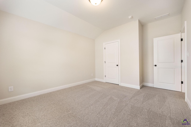 202 Bella Notte Cir, Warner Robins, GA 31088 - interior space with light colored carpet, baseboards, and vaulted ceiling