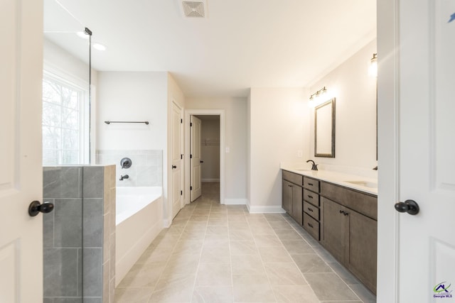 202 Bella Notte Cir, Warner Robins, GA 31088 - full bath with a bath, a sink, double vanity, visible vents, and a spacious closet