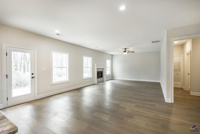 202 Bella Notte Cir, Warner Robins, GA 31088 - unfurnished living room with baseboards, visible vents, ceiling fan, and dark wood finished floors