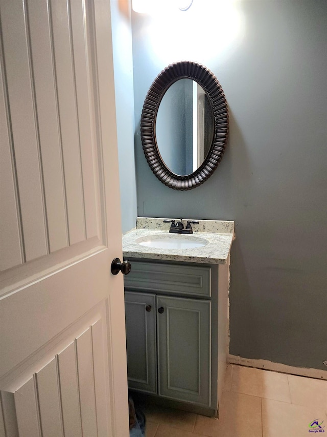 bathroom featuring tile patterned floors and vanity