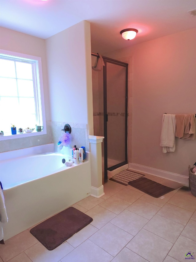 203 Lattice Bnd, Bonaire, GA 31005 - full bath with tile patterned flooring, a stall shower, a bath, and baseboards