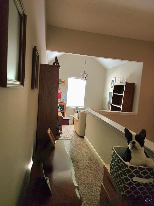 203 Lattice Bnd, Bonaire, GA 31005 - corridor featuring carpet, a chandelier, and vaulted ceiling