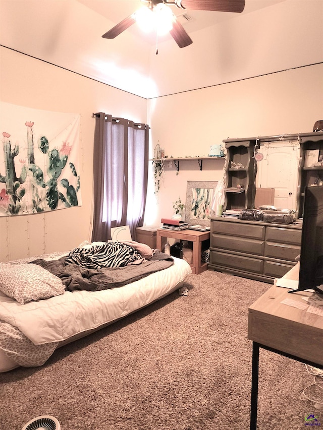 bedroom featuring ceiling fan and carpet