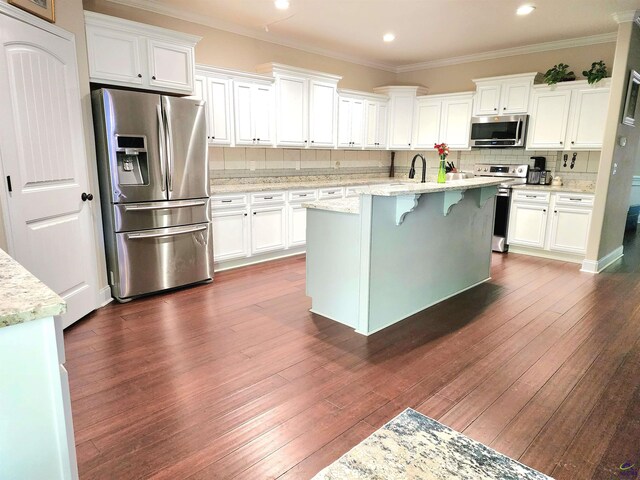 203 Lattice Bnd, Bonaire, GA 31005 - kitchen with appliances with stainless steel finishes, white cabinets, backsplash, ornamental molding, and recessed lighting