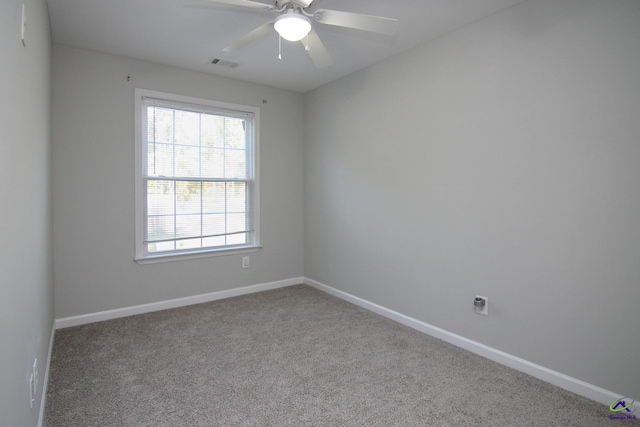 empty room featuring light carpet and ceiling fan