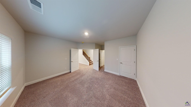 unfurnished room featuring carpet