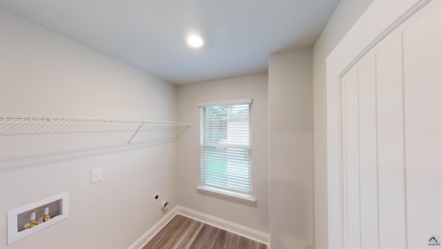 washroom featuring hardwood / wood-style floors, electric dryer hookup, and washer hookup