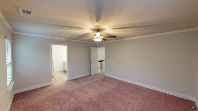 unfurnished bedroom with multiple windows, ornamental molding, light carpet, and ceiling fan