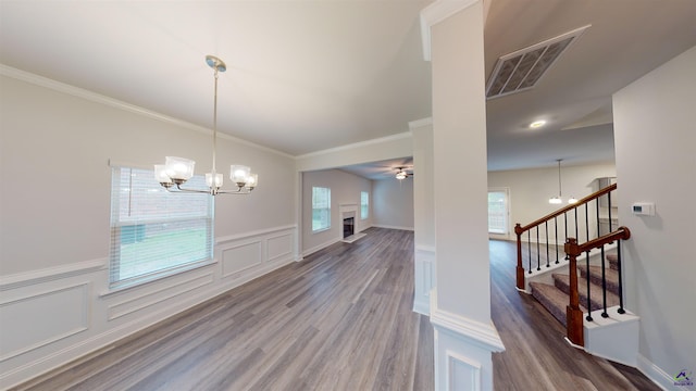 interior space featuring a chandelier, hardwood / wood-style floors, and a wealth of natural light