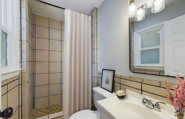 bathroom with toilet, tile walls, vanity, and a shower with shower curtain