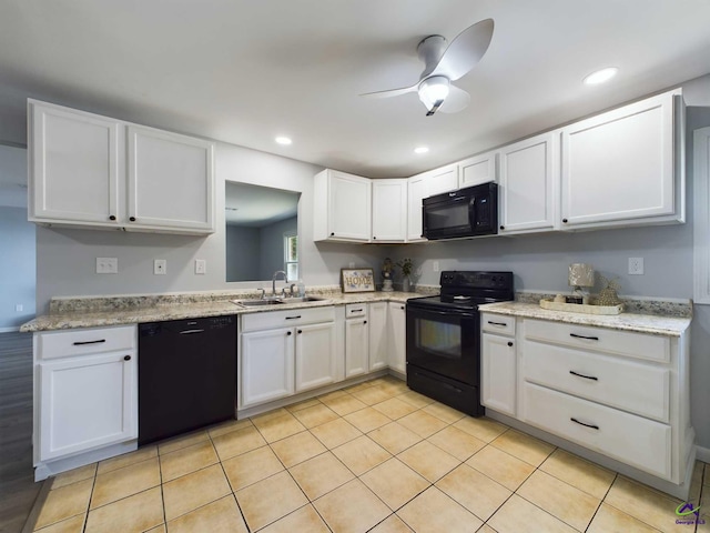 kitchen with sink, ceiling fan, white cabinetry, black appliances, and light tile patterned flooring