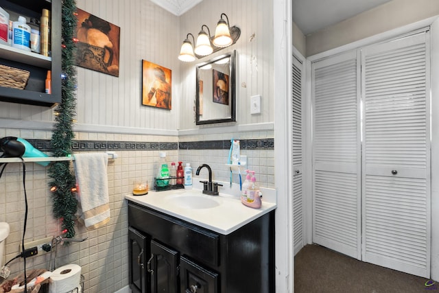 bathroom featuring tile walls and vanity