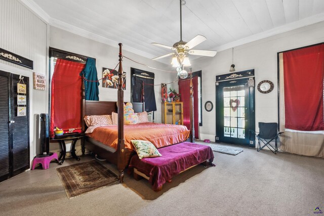 bedroom featuring carpet floors, ornamental molding, and ceiling fan