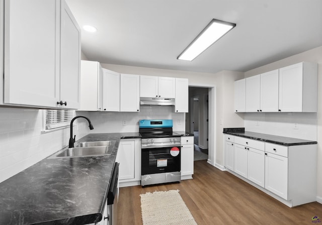 kitchen featuring white cabinets, appliances with stainless steel finishes, dark hardwood / wood-style floors, and sink